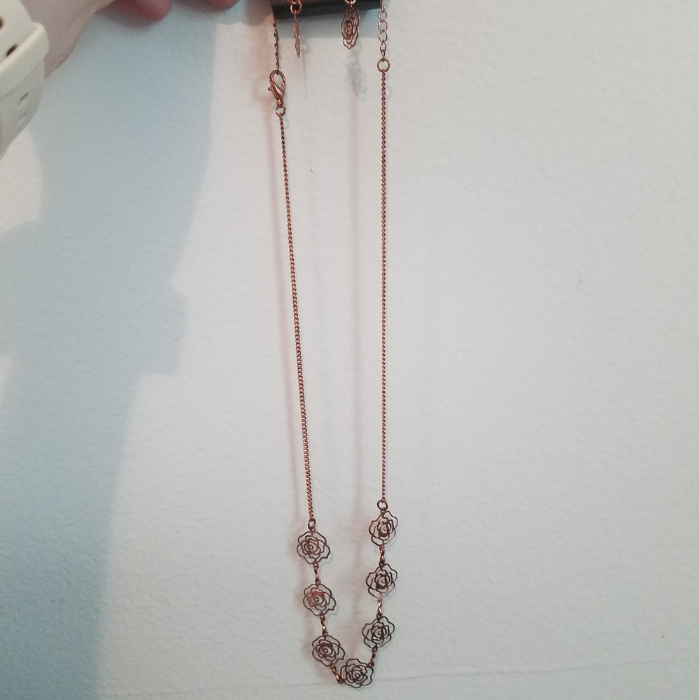 A rose necklace and earrings